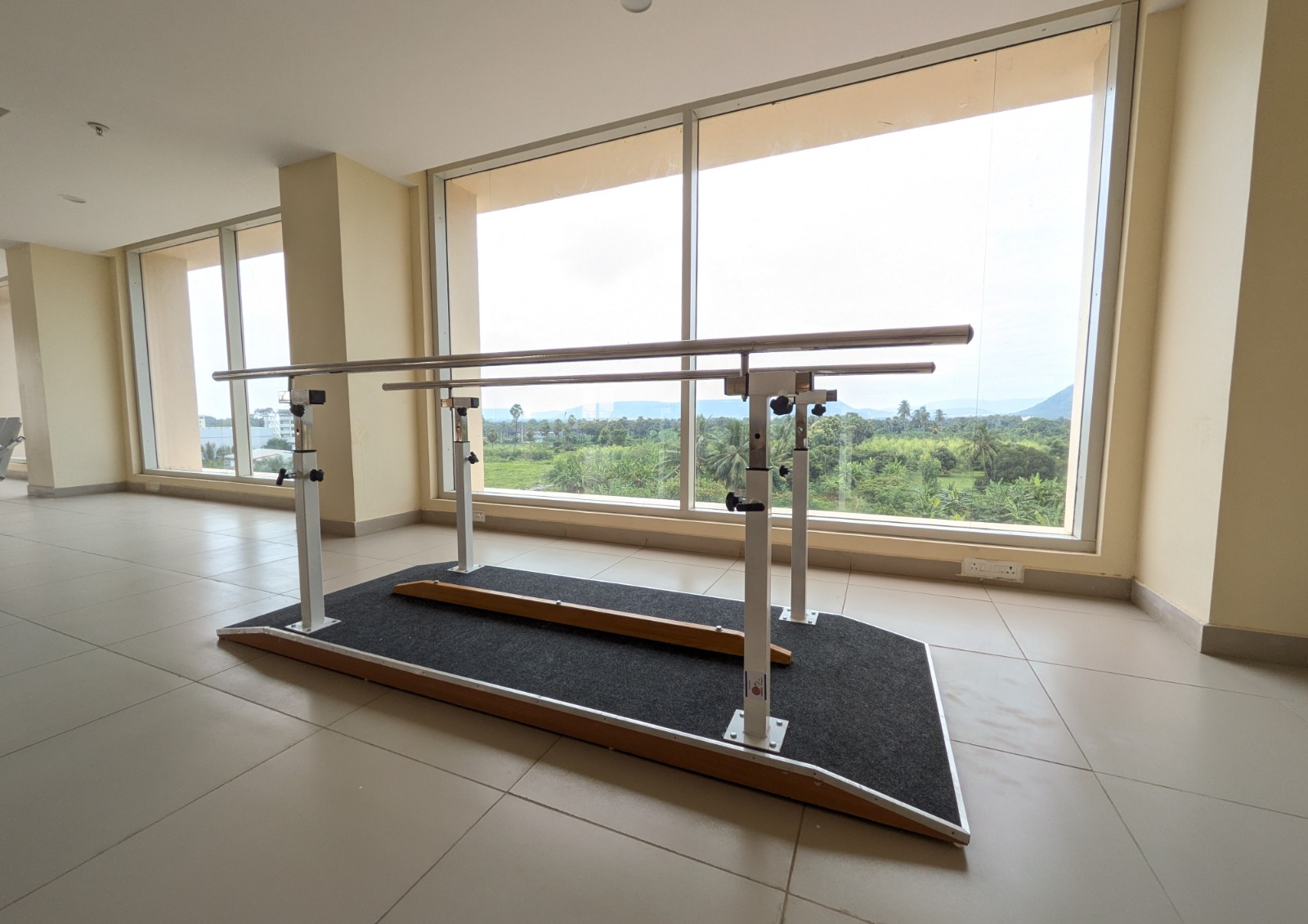 A serene view of the facility exterior with lush greenery.