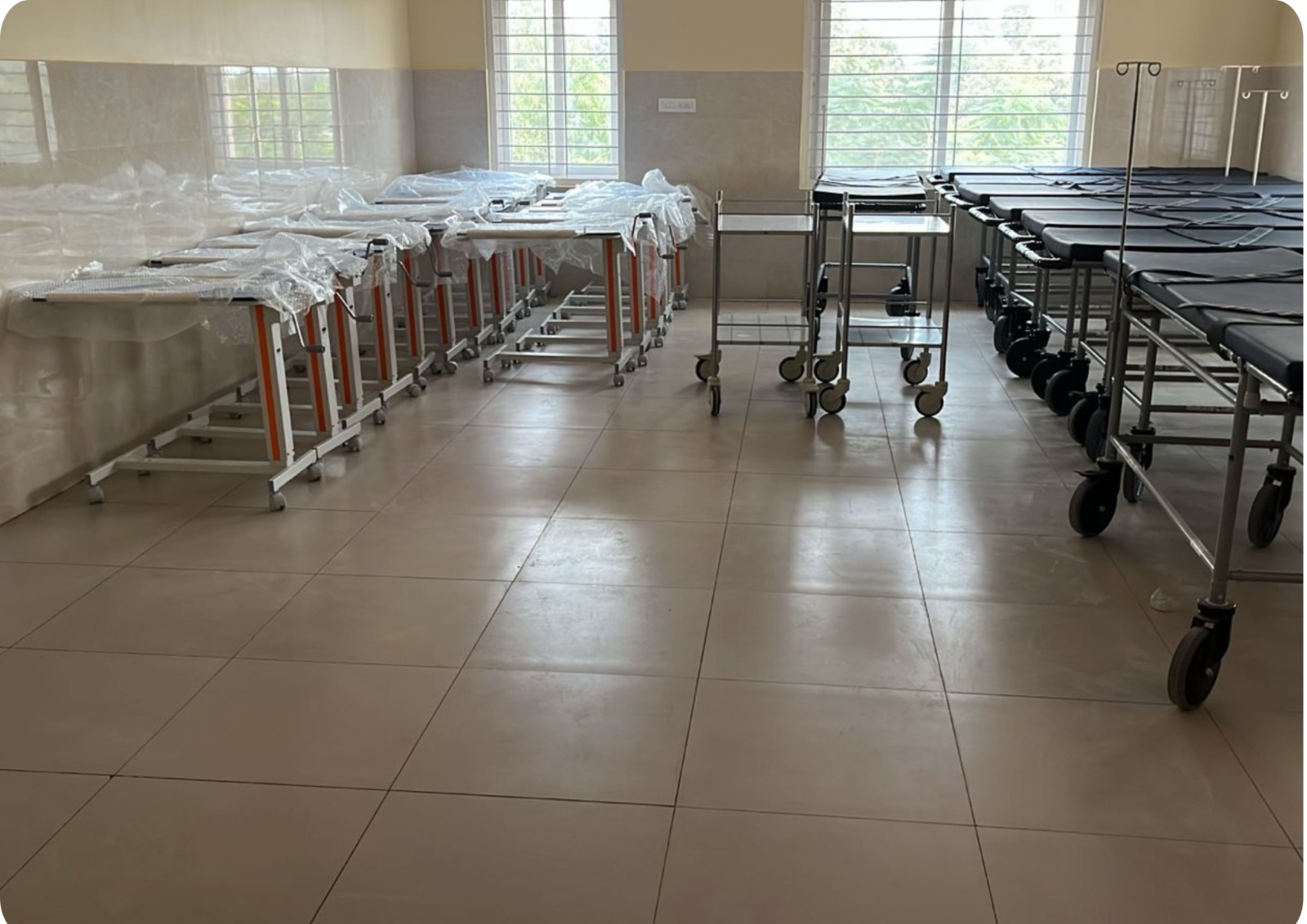 A wide shot of the hospital building and surrounding landscape.